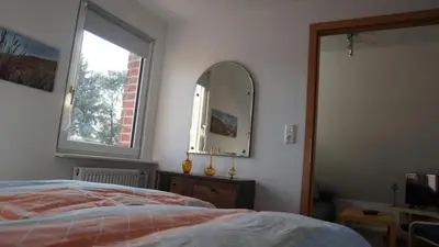 Ein Bett oder Betten in einem Zimmer der Unterkunft Pension Limone Ferienwohnung 1