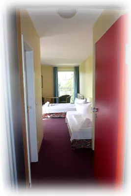 Ein Bett oder Betten in einem Zimmer der Unterkunft Hotel Lindenberger Hof