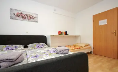 Ein Bett oder Betten in einem Zimmer der Unterkunft Hüblers-Schlafquartier