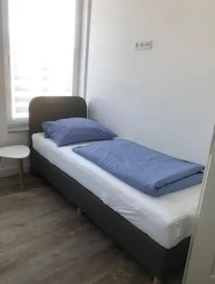 Ein Bett oder Betten in einem Zimmer der Unterkunft Trafohaus