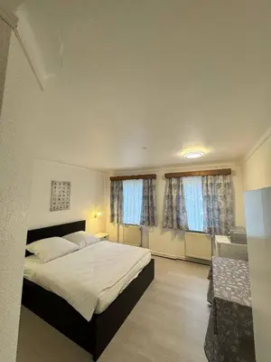Ein Bett oder Betten in einem Zimmer der Unterkunft Landhotel Waldschänke