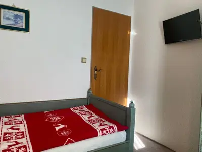 Ein Bett oder Betten in einem Zimmer der Unterkunft Landhotel Waldschänke