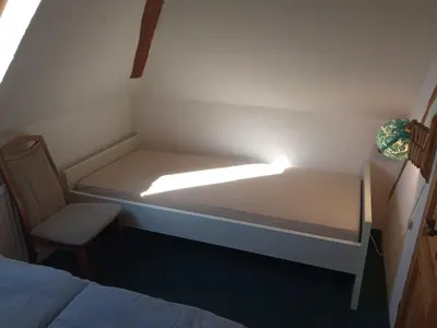 Ein Bett oder Betten in einem Zimmer der Unterkunft Landhotel Waldschänke