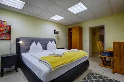 Ein Bett oder Betten in einem Zimmer der Unterkunft Hotel Waldschlösschen