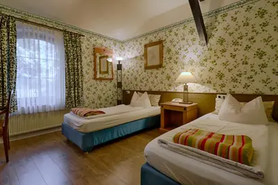 Ein Bett oder Betten in einem Zimmer der Unterkunft Hotel Waldschlösschen