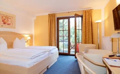 Ein Bett oder Betten in einem Zimmer der Unterkunft Hotel am Katharinenholz