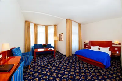 Ein Bett oder Betten in einem Zimmer der Unterkunft Hotel & Apartments Zarenhof Berlin Prenzlauer Berg