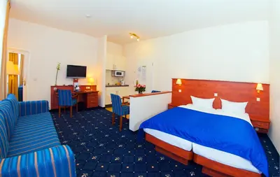 Ein Bett oder Betten in einem Zimmer der Unterkunft Hotel & Apartments Zarenhof Berlin Prenzlauer Berg