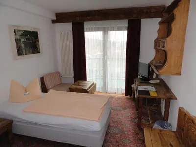 Ein Bett oder Betten in einem Zimmer der Unterkunft Solitaire Hotel