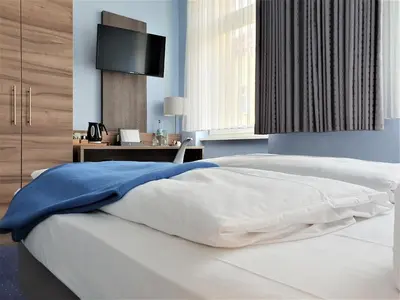 Ein Bett oder Betten in einem Zimmer der Unterkunft Melarose Feng Shui Hotel