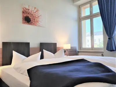 Ein Bett oder Betten in einem Zimmer der Unterkunft Melarose Feng Shui Hotel