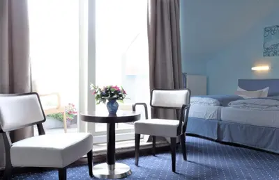 Ein Bett oder Betten in einem Zimmer der Unterkunft Melarose Feng Shui Hotel