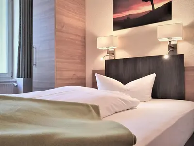 Ein Bett oder Betten in einem Zimmer der Unterkunft Melarose Feng Shui Hotel