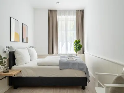 Ein Bett oder Betten in einem Zimmer der Unterkunft Apartments Berlin Lottumstraße 4