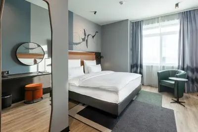 Ein Bett oder Betten in einem Zimmer der Unterkunft TITANIC Comfort Kurfürstendamm