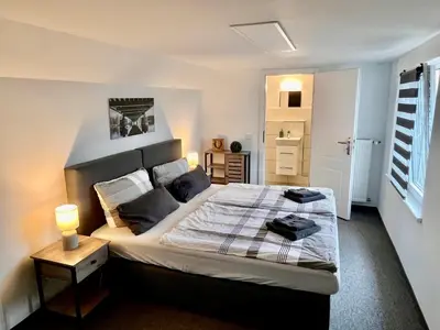 Ein Bett oder Betten in einem Zimmer der Unterkunft Gästezimmer Teltow