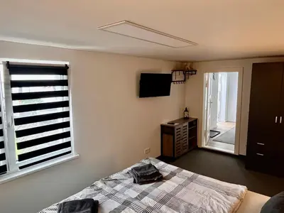 Ein Bett oder Betten in einem Zimmer der Unterkunft Gästezimmer Teltow