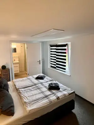 Ein Bett oder Betten in einem Zimmer der Unterkunft Gästezimmer Teltow