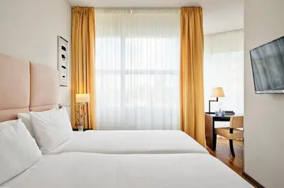 Ein Bett oder Betten in einem Zimmer der Unterkunft ABION Villa Suites