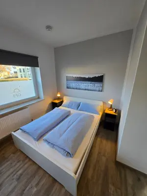 Ein Bett oder Betten in einem Zimmer der Unterkunft Pension GP3, Zimmer mit Kochnische und Duschbad vor den Toren Berlins