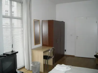Ein Bett oder Betten in einem Zimmer der Unterkunft Pension Mitte