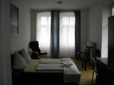 Ein Bett oder Betten in einem Zimmer der Unterkunft Pension Mitte