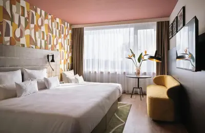 Ein Bett oder Betten in einem Zimmer der Unterkunft NYX Hotel Berlin Köpenick by Leonardo Hotels