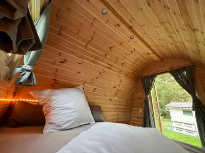 Ein Bett oder Betten in einem Zimmer der Unterkunft Ferienhaus im Wald