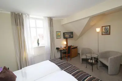 Ein Bett oder Betten in einem Zimmer der Unterkunft Gut Hotel Stadt Beelitz