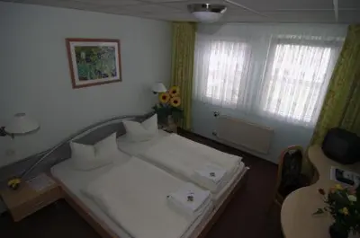 Ein Bett oder Betten in einem Zimmer der Unterkunft Waldhotel Seelow