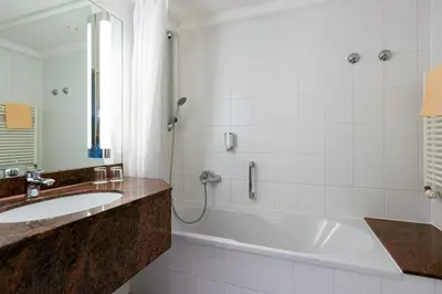 Ein Badezimmer in der Unterkunft Schlosspark Hotel