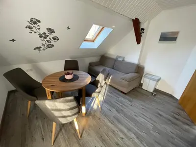 Ein Sitzbereich in der Unterkunft Ferienwohnung Zum Schloß