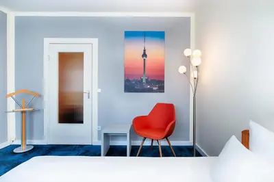 Ein Bett oder Betten in einem Zimmer der Unterkunft Hotel Carolinenhof