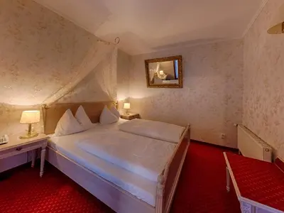 Ein Bett oder Betten in einem Zimmer der Unterkunft Seeschloß