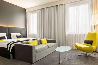 Ein Bett oder Betten in einem Zimmer der Unterkunft Vienna House by Wyndham Andel's Berlin