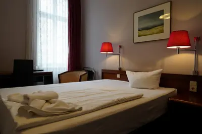 Ein Bett oder Betten in einem Zimmer der Unterkunft Hotel Xantener Eck