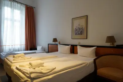 Ein Bett oder Betten in einem Zimmer der Unterkunft Hotel Xantener Eck