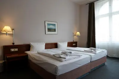 Ein Bett oder Betten in einem Zimmer der Unterkunft Hotel Xantener Eck