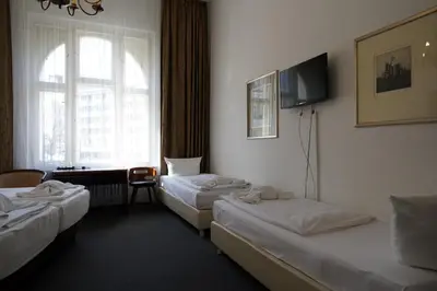Ein Bett oder Betten in einem Zimmer der Unterkunft Hotel Xantener Eck