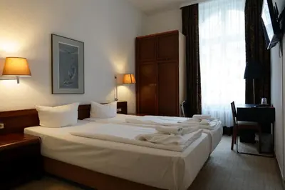 Ein Bett oder Betten in einem Zimmer der Unterkunft Hotel Xantener Eck