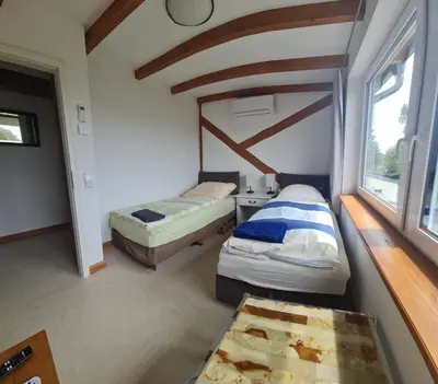 Ein Bett oder Betten in einem Zimmer der Unterkunft Monteurwohnung SEEBLICK AUSBLICK 16356 Werneuchen bei Berlin