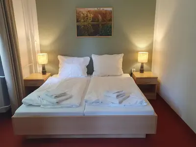 Ein Bett oder Betten in einem Zimmer der Unterkunft seezeit-resort am Werbellinsee