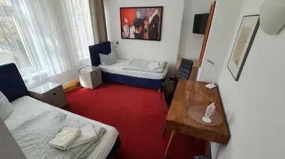 Ein Bett oder Betten in einem Zimmer der Unterkunft Bornholmer Hof im Prenzlauer Berg