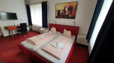 Ein Bett oder Betten in einem Zimmer der Unterkunft Bornholmer Hof im Prenzlauer Berg