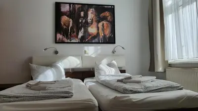 Ein Bett oder Betten in einem Zimmer der Unterkunft Bornholmer Hof im Prenzlauer Berg