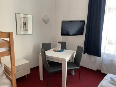 Ein Bett oder Betten in einem Zimmer der Unterkunft Bornholmer Hof im Prenzlauer Berg