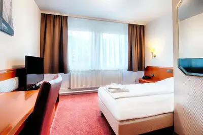 Ein Bett oder Betten in einem Zimmer der Unterkunft Hotel B1