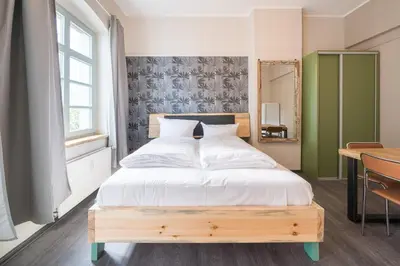 Ein Bett oder Betten in einem Zimmer der Unterkunft Design Apartments - 