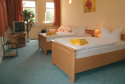 Ein Bett oder Betten in einem Zimmer der Unterkunft Hotel Kubrat an der Spree