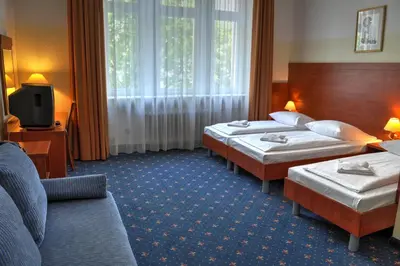 Ein Bett oder Betten in einem Zimmer der Unterkunft Hotel Europa City